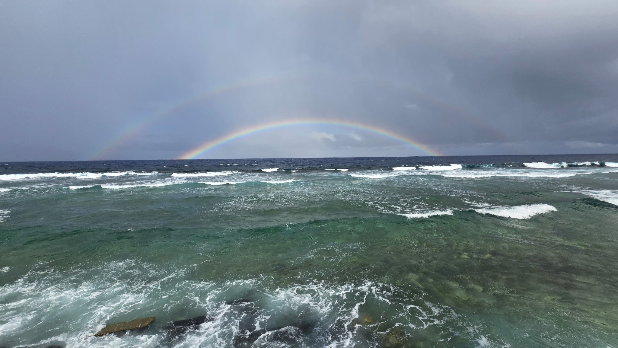 Rainbow over the ocean in Tuvalu.